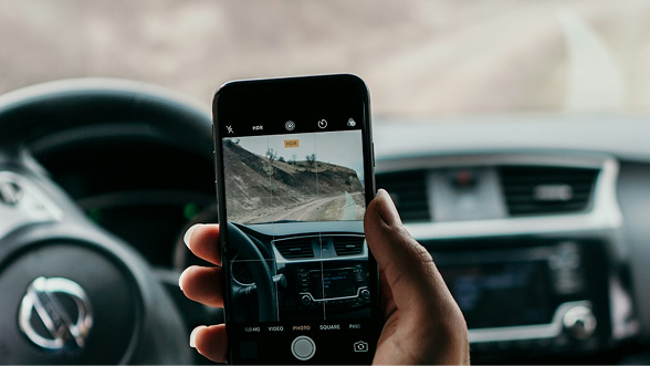 Host photographing their car for a listing