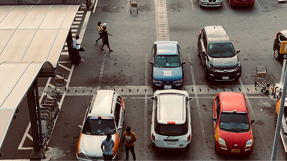 Cars parked in marked bays at a return point